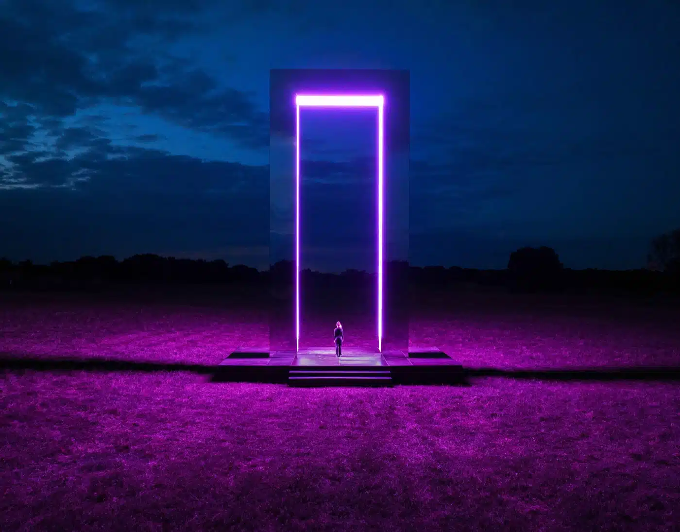 A stunning neon-lit installation glowing under a dark sky, showcasing the immersive art of the Winter Lights Festival in London.