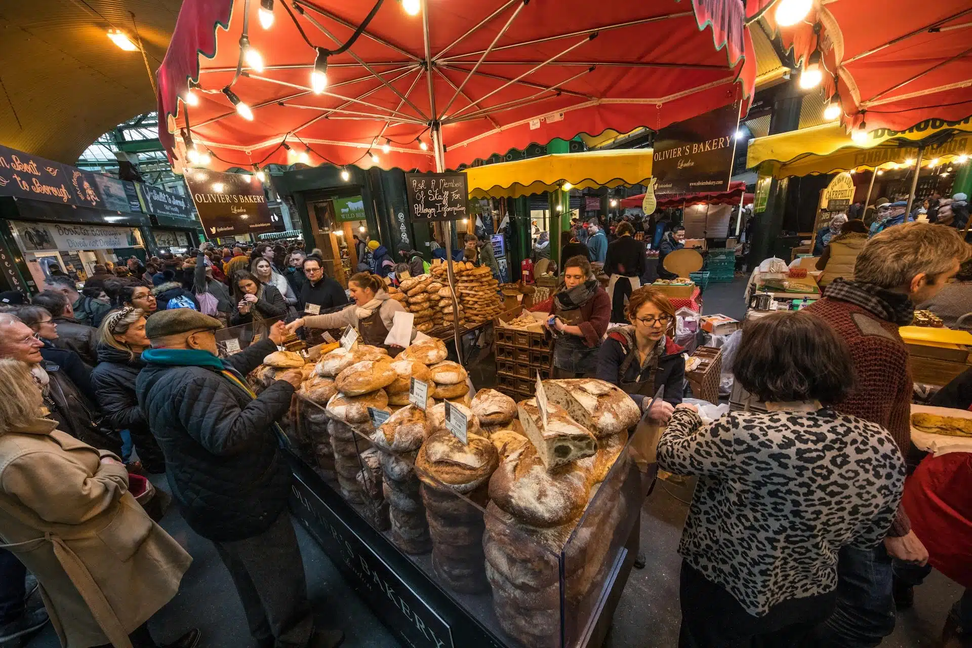 Vibrant bakery stall at a bustling market—offering Unique Experiences in London through food and community vibes.
