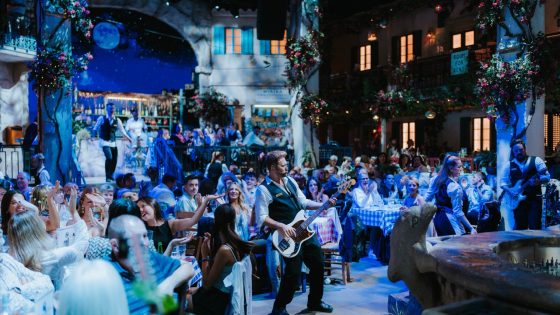 Guests enjoying live music and vibrant performances at the Mamma Mia Party O2, recreating the magic of the iconic musical.