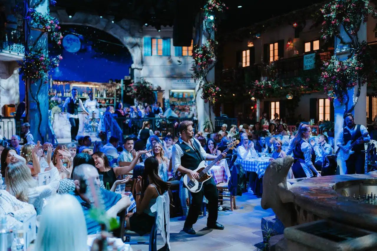 Guests enjoying live music and vibrant performances at the Mamma Mia Party O2, recreating the magic of the iconic musical.
