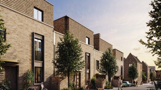 Modern townhouses with brick facades and tree-lined streets at Trinity Park Woolwich, offering serene living spaces in London.