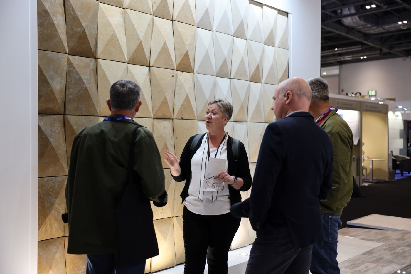 Professionals discussing innovative design solutions at UKCW London, showcasing the latest trends in construction and architecture.