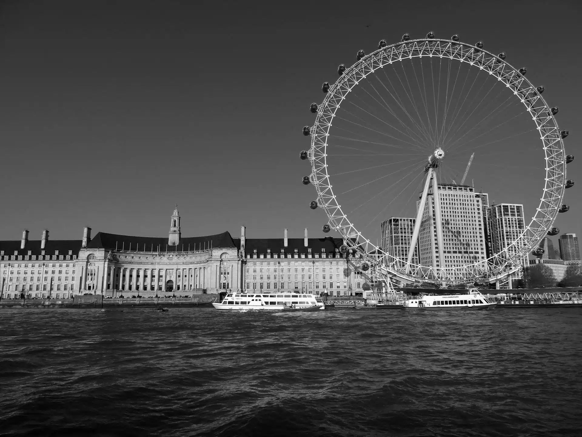 The iconic London Eye and historic riverside architecture, showcasing one of the city's top-rated attractions along the Thames.