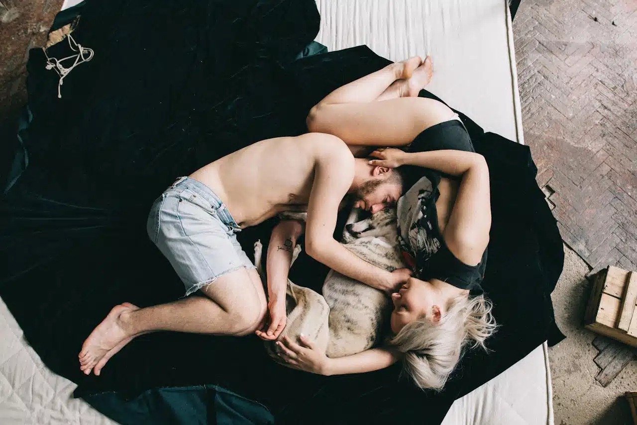 Best London Boroughs for Families featuring a couple and their dog cuddling in a cozy home setting, highlighting family-friendly living