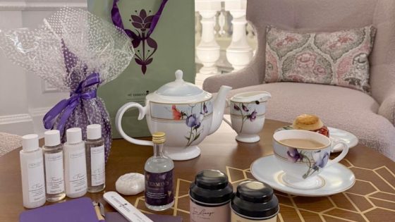 Elegant Mother’s Day Afternoon Tea setup with floral china, luxury teas, and pampering gifts in a refined, cozy London setting.