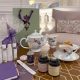 Elegant Mother’s Day Afternoon Tea setup with floral china, luxury teas, and pampering gifts in a refined, cozy London setting.