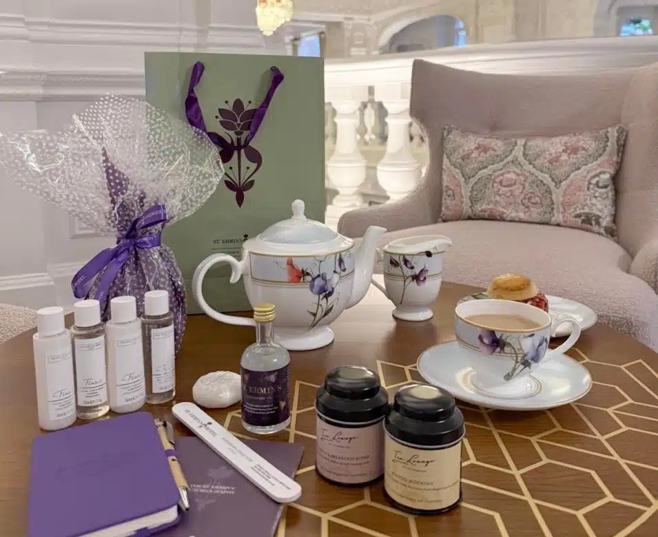 Elegant Mother’s Day Afternoon Tea setup with floral china, luxury teas, and pampering gifts in a refined, cozy London setting.