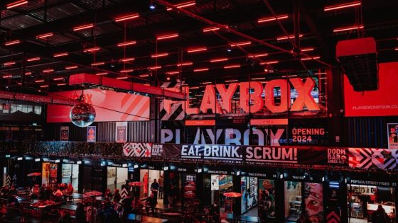 PLAYBOX Croydon vibrant indoor food and entertainment hub with neon lights, dining stalls, and lively social spaces.