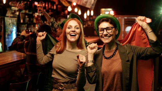 Joyful celebrations of St Patrick’s Day in London, featuring vibrant outfits, Irish flags, and festive pub vibes in the heart of the city.