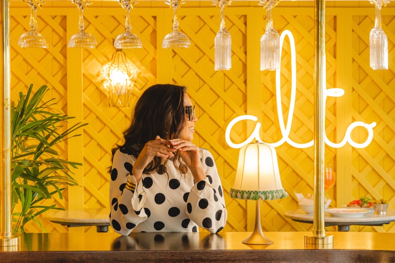 Woman dining at Alto by San Carlo rooftop bar